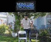 a man stands in front of a sign that says monsters unchained the frankenstein experiment