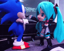 sonic the hedgehog and hatsune miku are dancing together