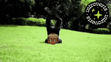 a cartoon character is doing a handstand in the grass with the words introverts in the background