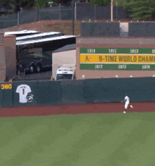 a baseball field with a sign that says 9 time world on it