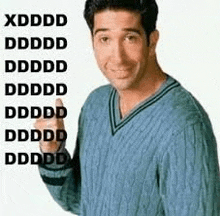 a man wearing a blue sweater is giving a thumbs up .