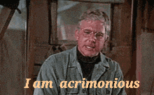 a man wearing glasses says i am acrimonyous