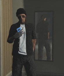 a man is standing in front of a mirror holding a cell phone that says ' samsung ' on it