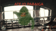 a ghostbusters poster with a green monster and the words " atejo pabaiga "