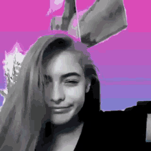a girl with bunny ears on her head looks at the camera