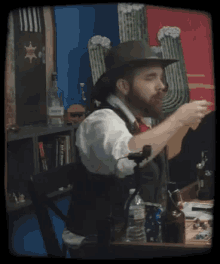 a man with a beard is drinking from a glass in front of a sheriff 's star
