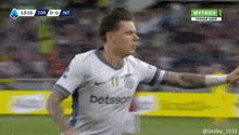 a soccer player wearing a betsson jersey celebrates