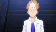 a boy with a star on his head is standing on a set of stairs .