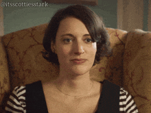 a woman is sitting in a chair with the caption tough crowd