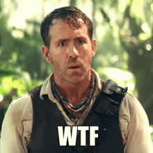 a man in a vest with the word wtf written on his chest