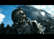 a close up of a robot with a blue sky behind it