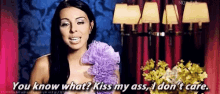a woman is holding a bouquet of flowers and saying you know what kiss my ass i don 't care