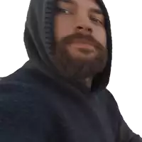 a man with a beard wearing a black hoodie smiles
