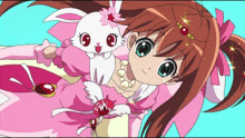 a girl in a pink dress is laying next to a rabbit