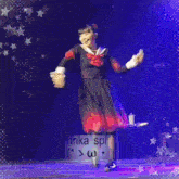 a group of girls are dancing on a stage and the words inka spin are on the bottom