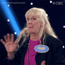 an older woman with a name tag that says penny