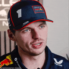 a man wearing a hat that says oracle red bull racing