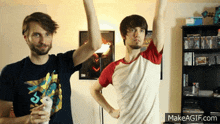 two men are playing a video game and one is wearing a shirt that says 5