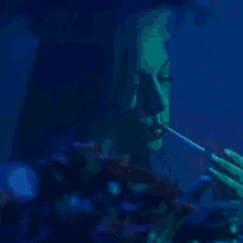 a woman lighting a cigarette with a lighter
