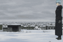 a man in a black coat stands on a snowy rooftop overlooking a snowy city