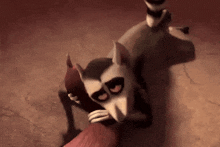 a cartoon lemur is hugging another lemur in a dark room .