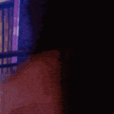 a man in a police uniform is standing on a balcony with a sign that says e on it