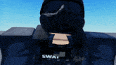a swat officer wearing a gas mask and vest