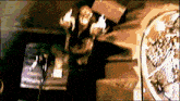 a blurry picture of a person sitting on a couch