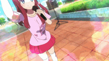 a girl is singing into a microphone while wearing a pink shirt that says ' i love you ' on it