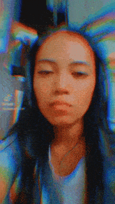 a blurry photo of a woman with a rainbow background