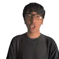 a man wearing glasses and a black shirt with the word sean on it