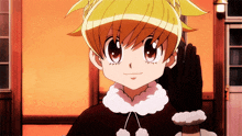 a girl with blonde hair and a black glove is smiling