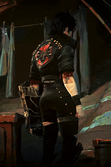 a person with a tattoo on their arm is wearing a black jacket with a dragon on the back
