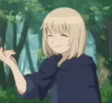 a blonde anime girl is smiling and holding a red apple