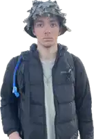 a man wearing an eddie bauer jacket and a hat