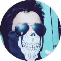 a man wearing a skull mask and sunglasses