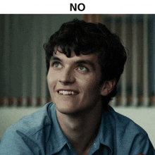 a close up of a man 's face with the words " no " above him