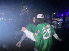 a man wearing a jersey with the number 25 on it