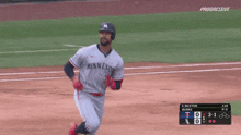 a baseball player wearing a minnesota jersey runs on the field