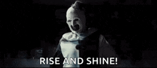 a clown with his arms outstretched is screaming and saying `` rise and shine '' .