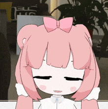 a cartoon girl with a pink bow on her head