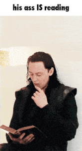 Loki Reading GIF - Loki Reading His Ass Is GIFs