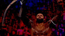 a man in a wrestling ring with a belt that says intercontinental heavyweight champion on it