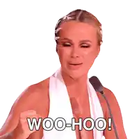 a woman speaking into a microphone with the words woo-hoo written on the bottom