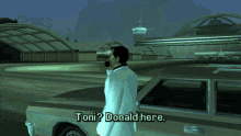a man in a white coat is standing in front of a car and talking to donald here