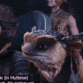 a close up of a creature with the word huttese on the bottom