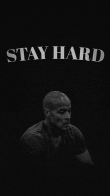 a black and white photo of a man says stay hard
