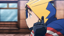 a cartoon character with a yellow hood and a red white and blue shirt