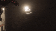 a close up of a robot 's face in the dark with its mouth open .