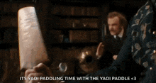 a person is holding a piece of paper in their hand with the words `` its yaoi paddling time with the yaoi paddle ''